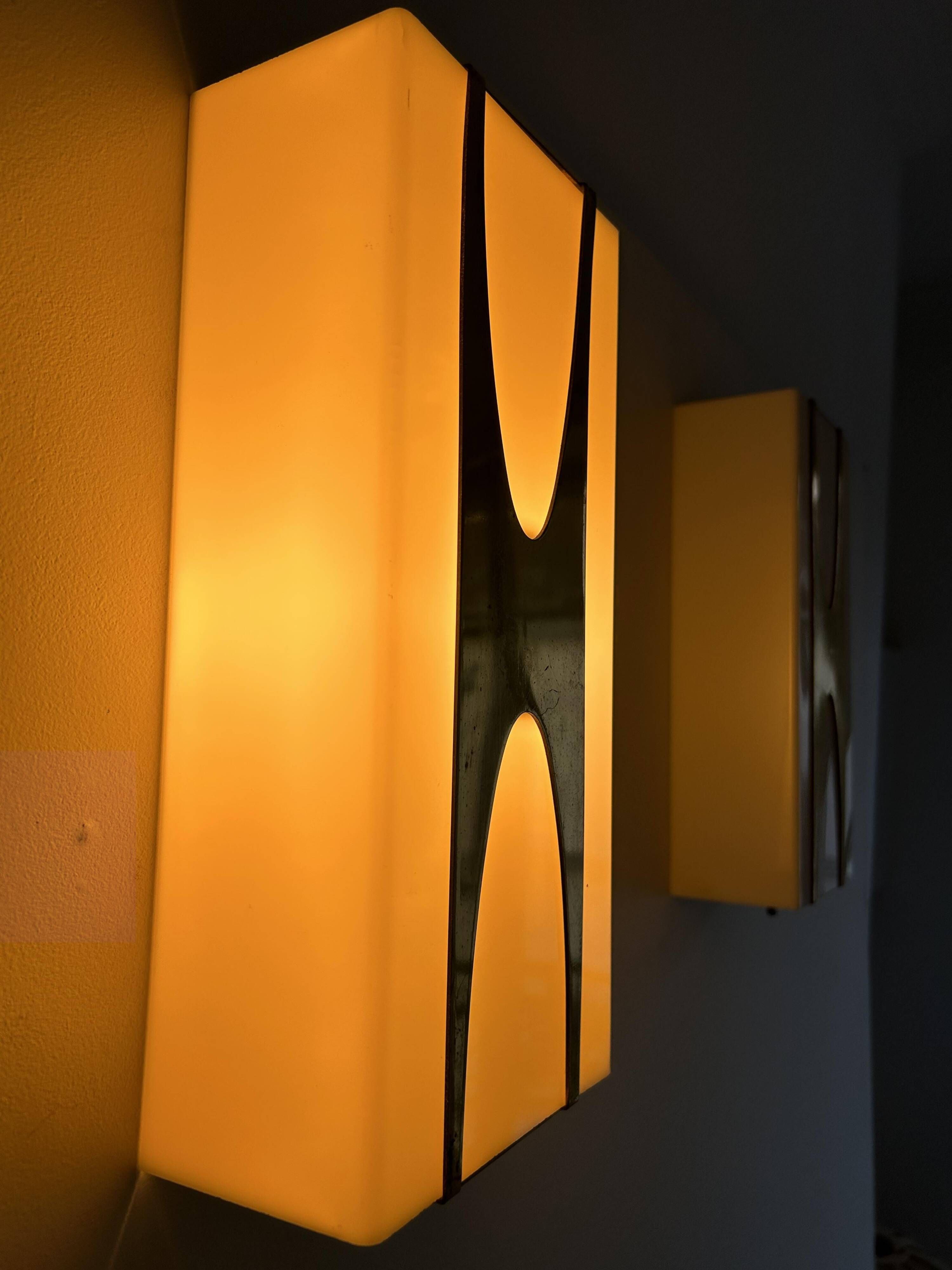 Pair of Loewy wall lights for Hilton, brass and Perspex, France 1965