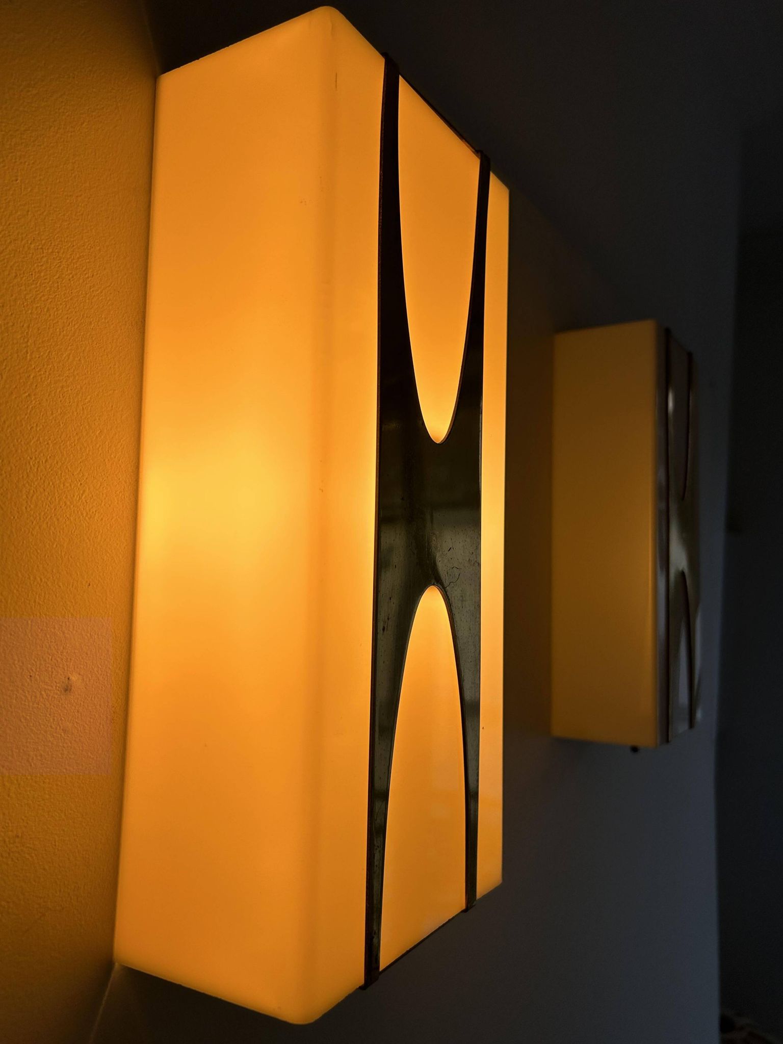Pair of Loewy wall lights for Hilton, brass and Perspex, France 1965