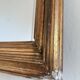 Antique giltwood wall mirror in gold