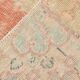 Tapis vintage oriental rouge et saumon