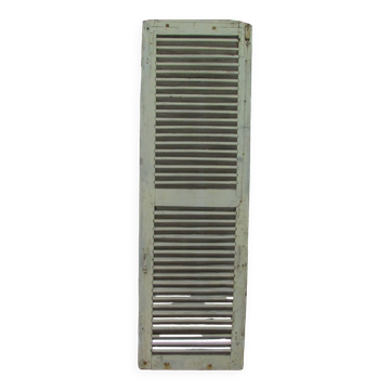 Old wooden shutter with perforations.