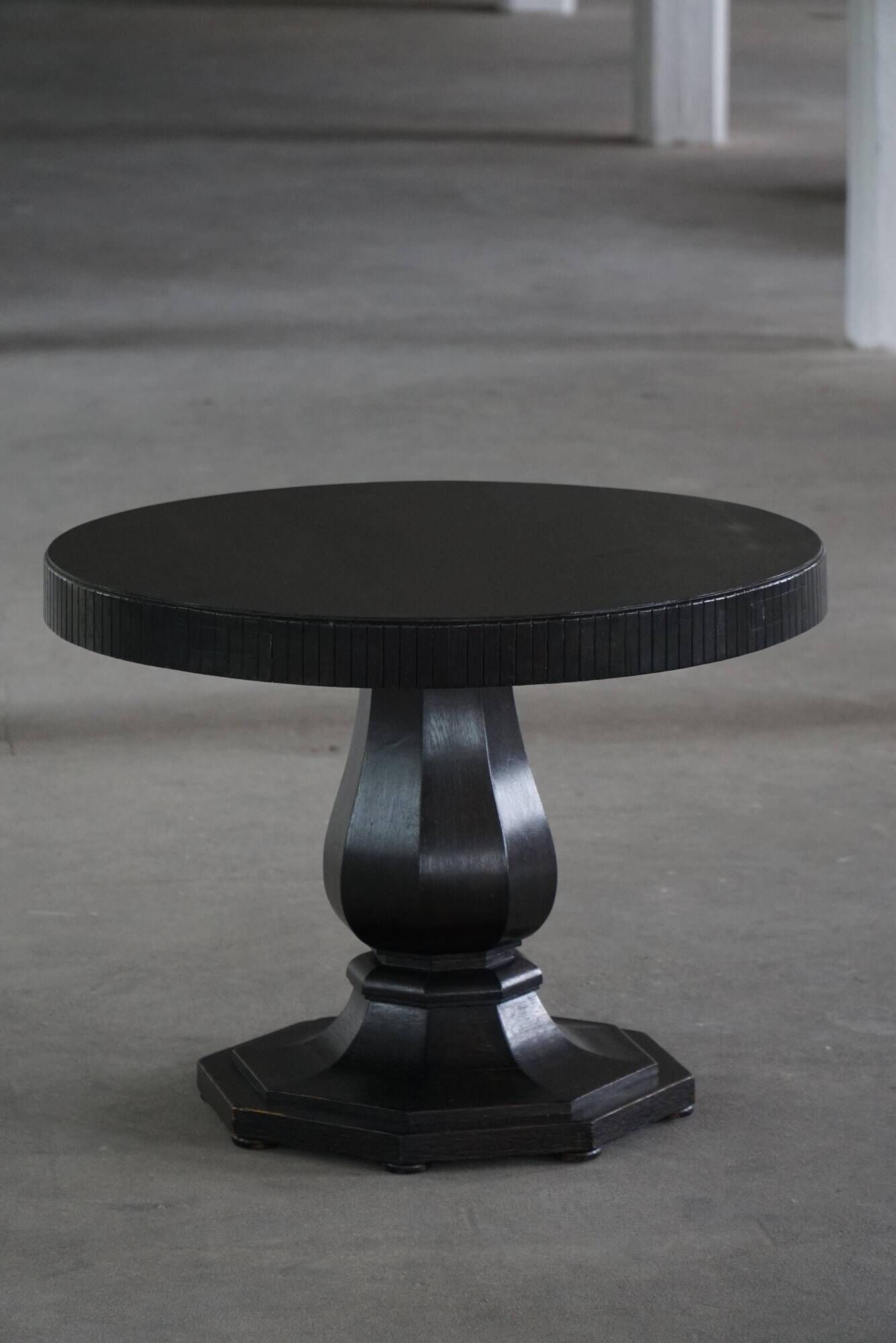 Dining table / round console in Danish Art Deco style in blackened oak, early 20th century.
