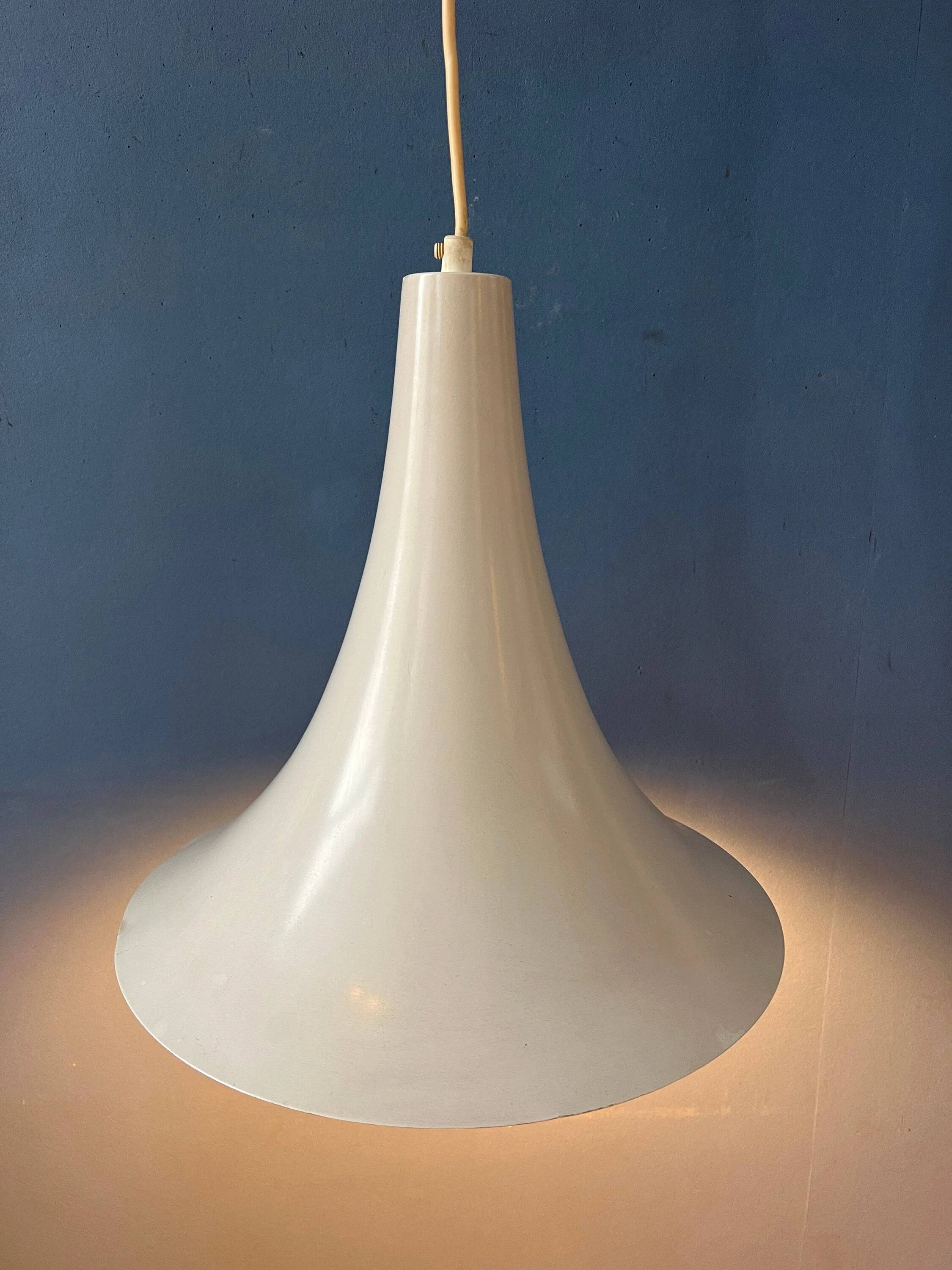 Small vintage beige pendant light in the shape of a witch's hat.