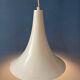 Small vintage beige pendant light in the shape of a witch's hat.