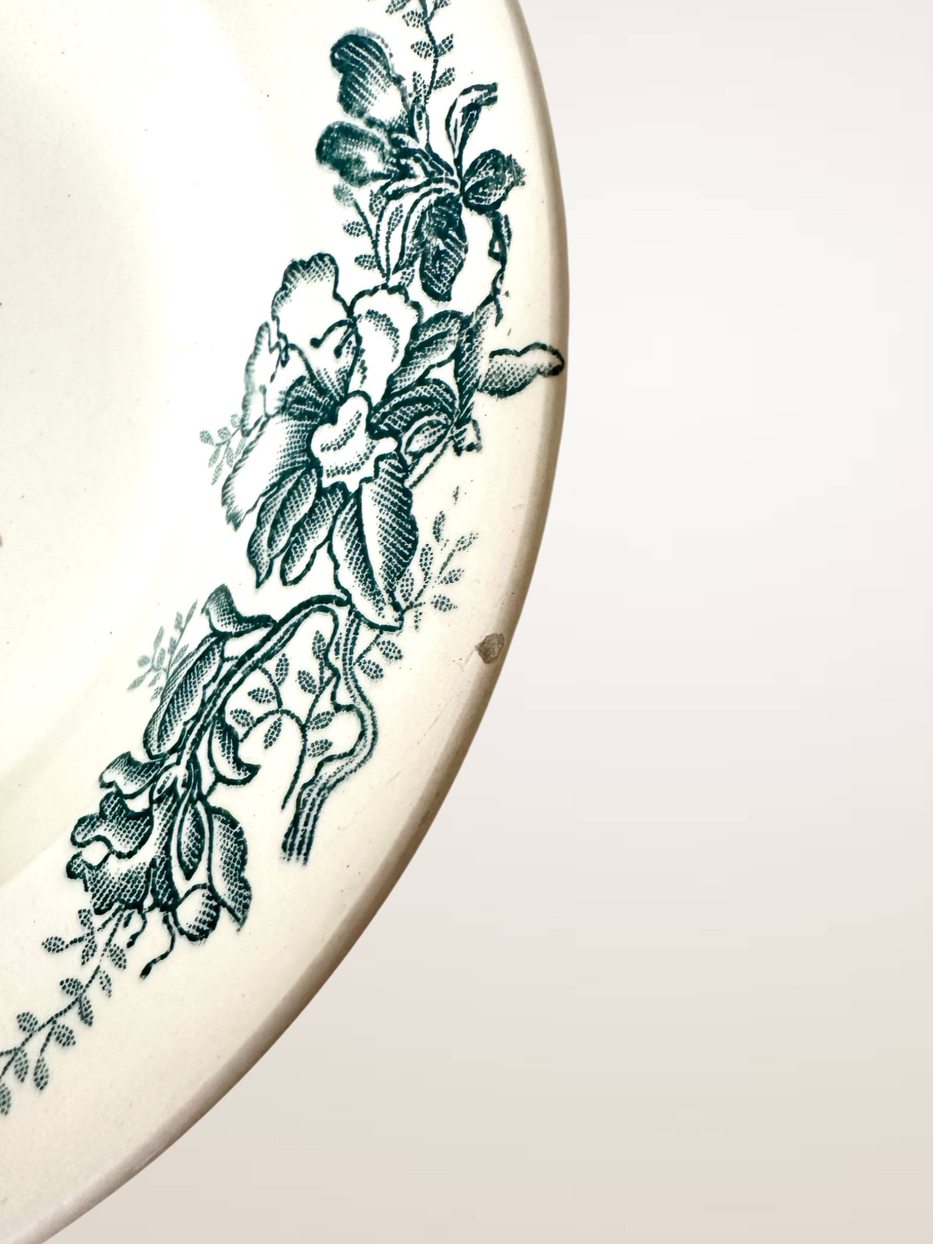 Set of nine deep plates in Givors earthenware, "Floreal" model.