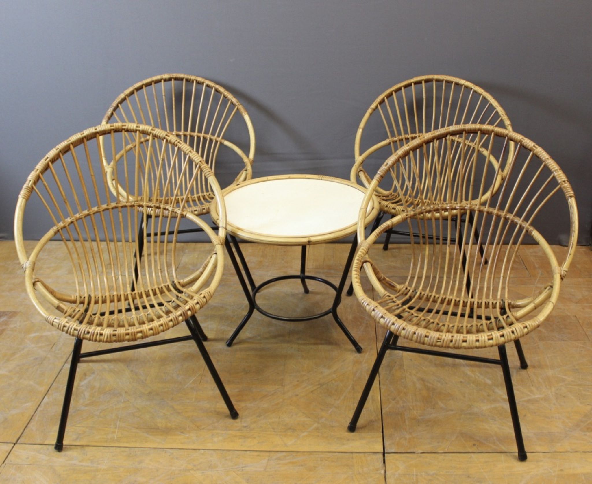 Living room in rattan and black lacquered iron by Rohe Noordwole circa 1950
