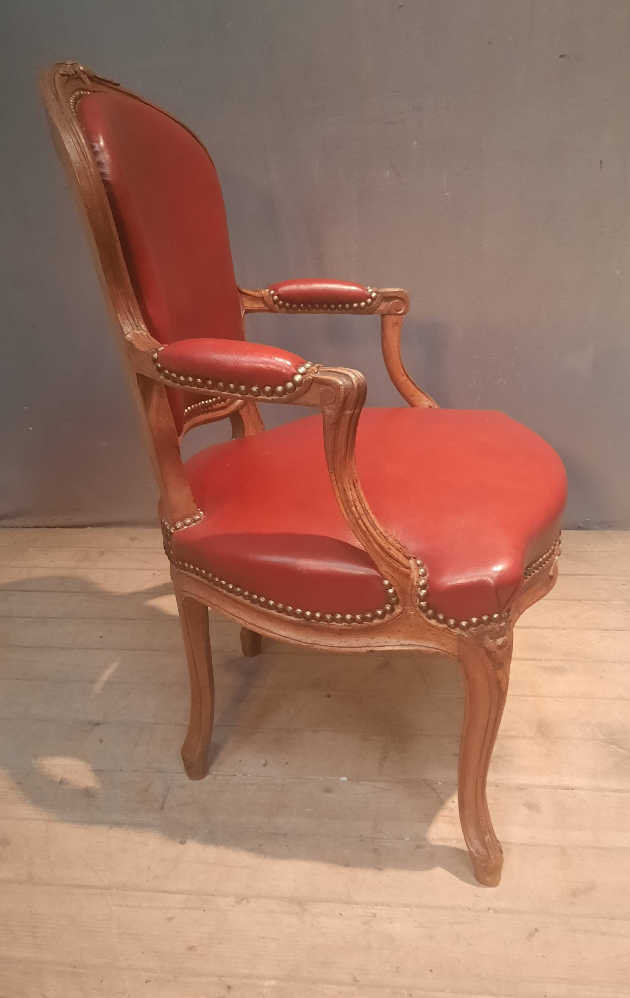 Louis XV period armchair covered in leather.
