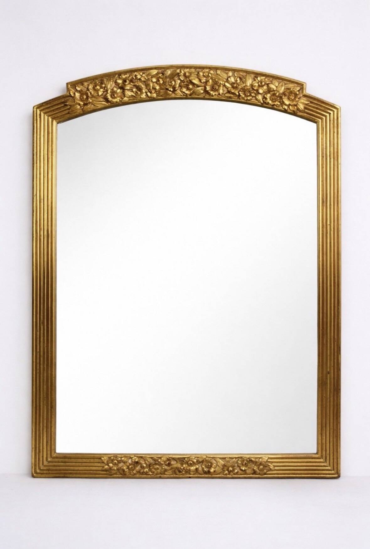 Large vintage gold mirror in Louis XVI style – fluted frame and floral decoration.