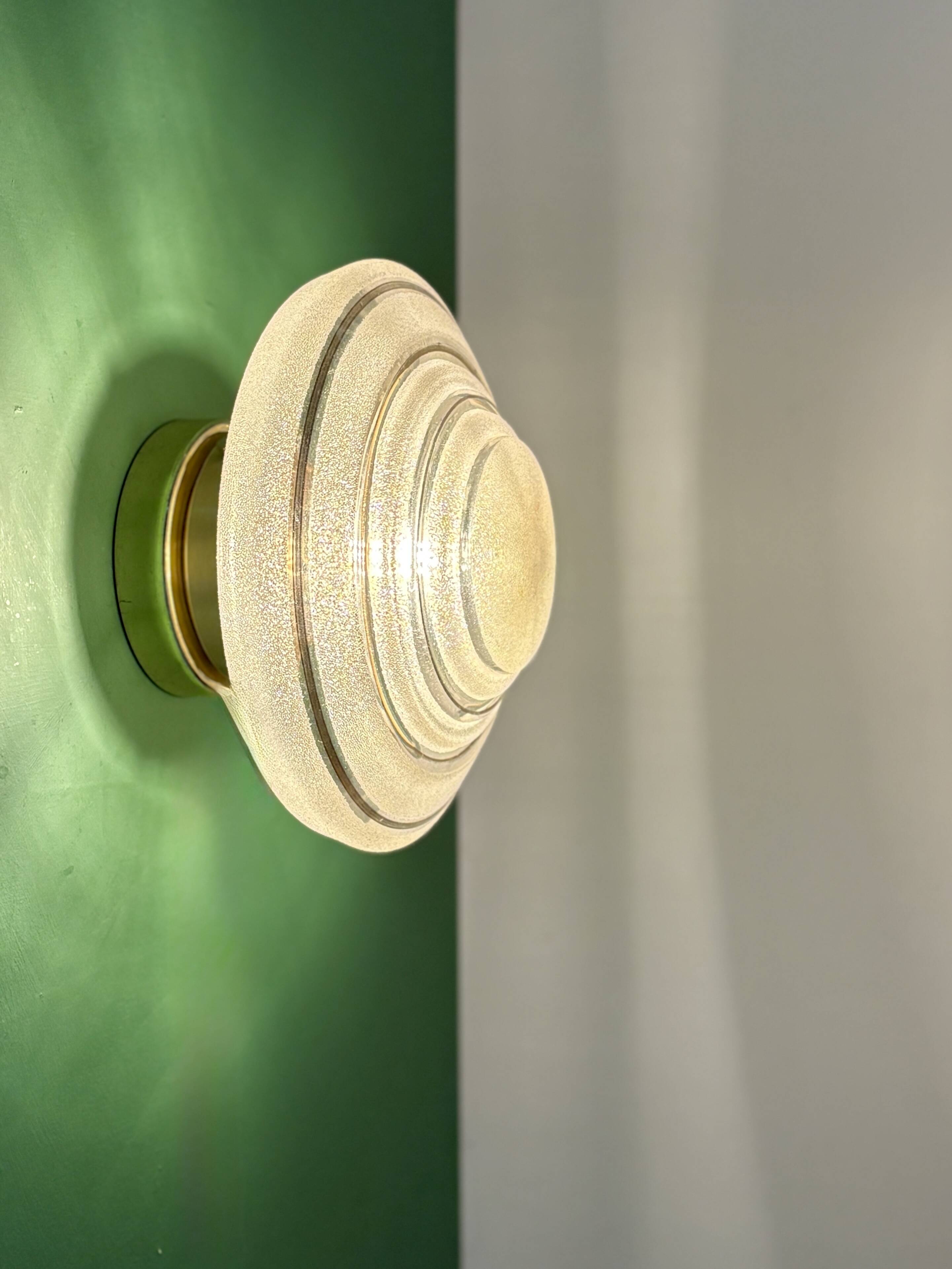 Old glass globe wall/ceiling light in frosted white and gold.