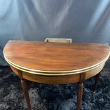 A Louis XVI period mahogany half-moon table forming a console/games table