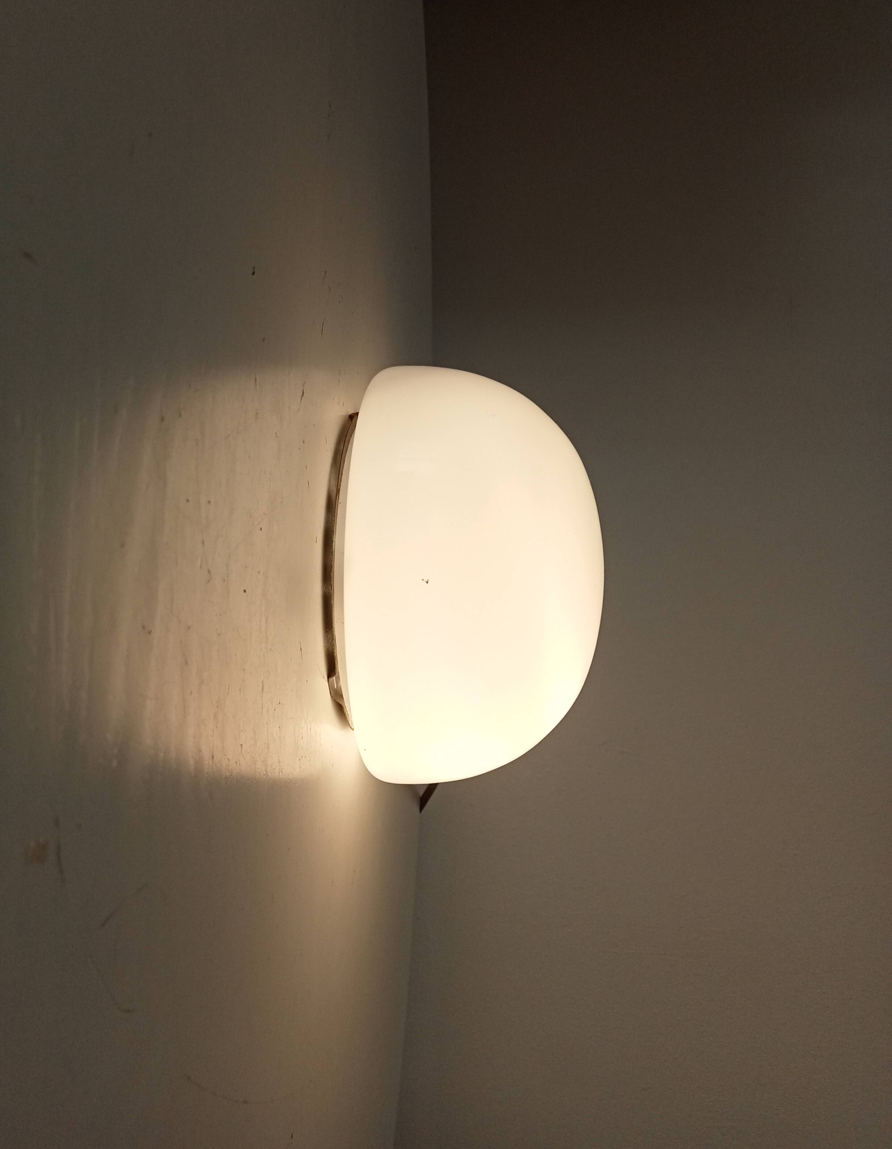 Vintage opaline wall light from the 1960s.