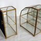 Pair of gilded brass, glass, mirror display cases from the 60s