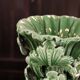 Green vase from Manises with leaf decoration.