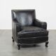 Armchair in black grained cowhide leather with a deep seat