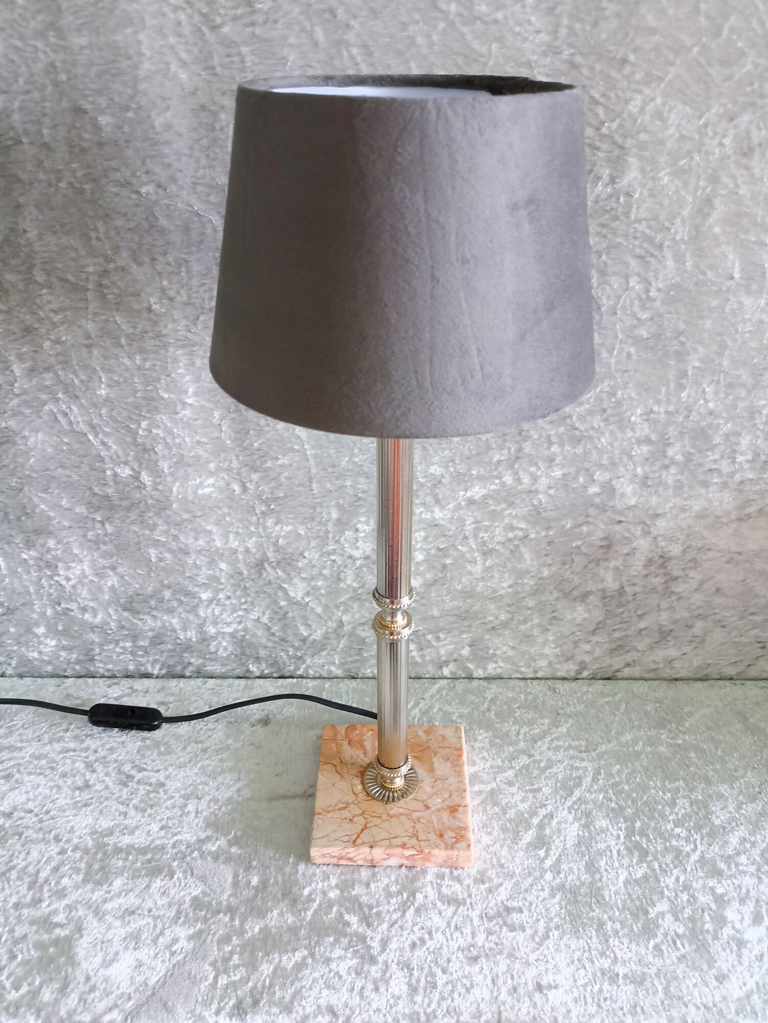 Golden metal lamp with pink marble base