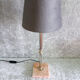 Golden metal lamp with pink marble base