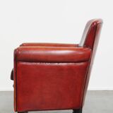 Armchair made of sheepskin leather in a red/brown color