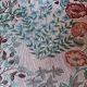 pair of toad armchairs in floral fabric.