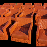Pair of vintage orange leather armchairs