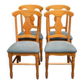 4 Landes chairs with solid wood frames and grey fabric.