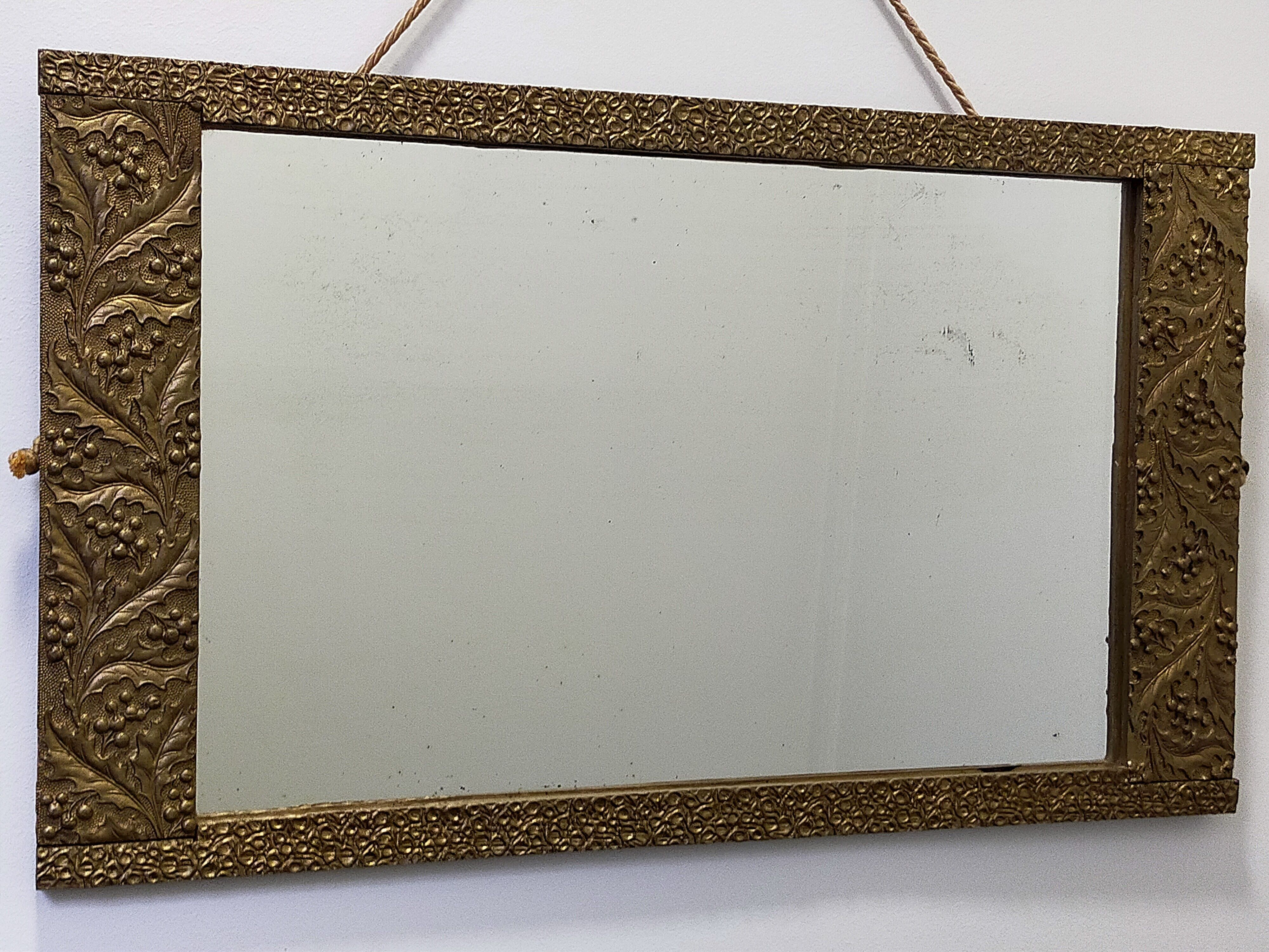 Art-deco gold mirror with vegetal décor  52x31cm