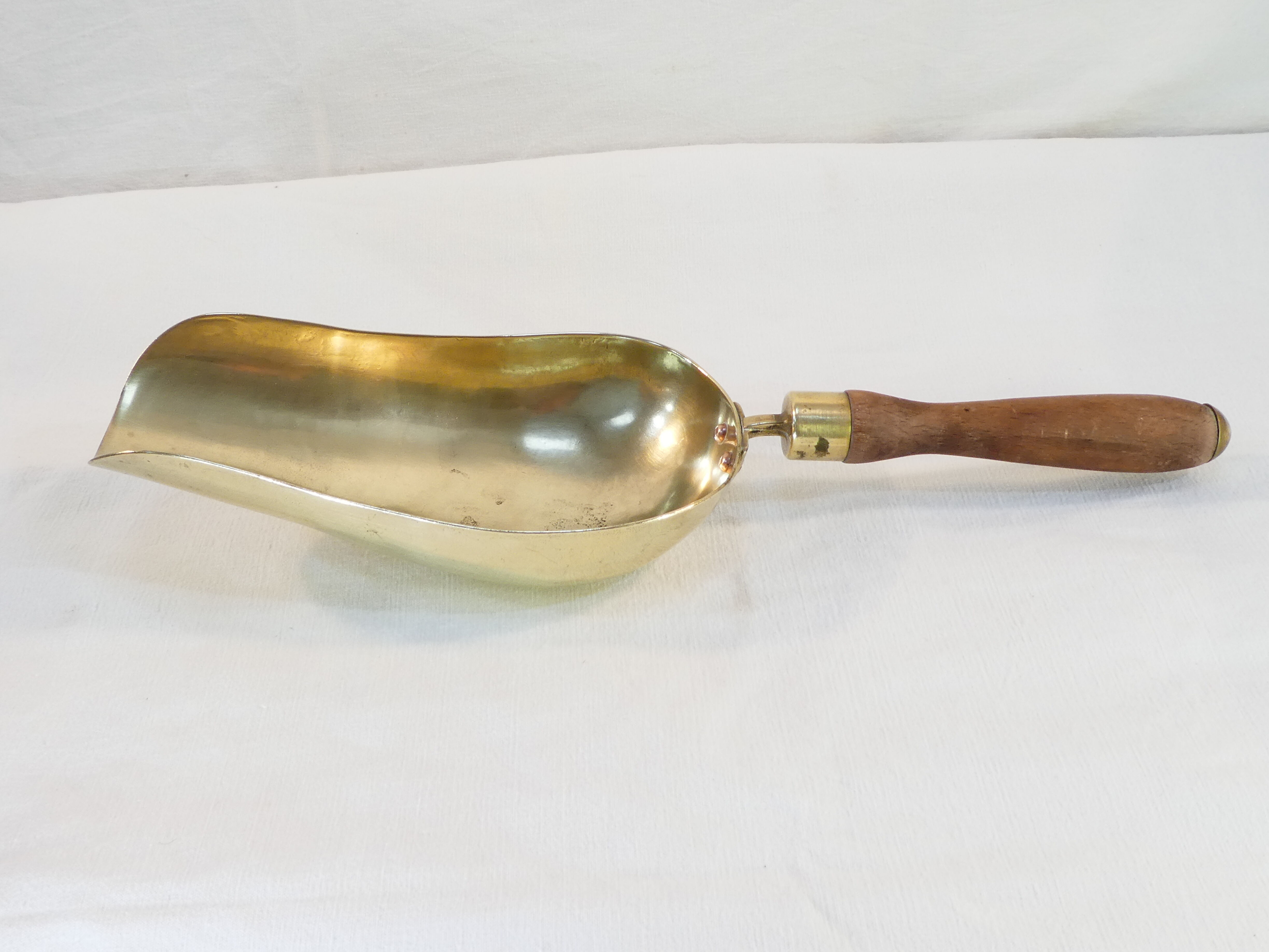 Old brass grocery grain shovel wooden handle