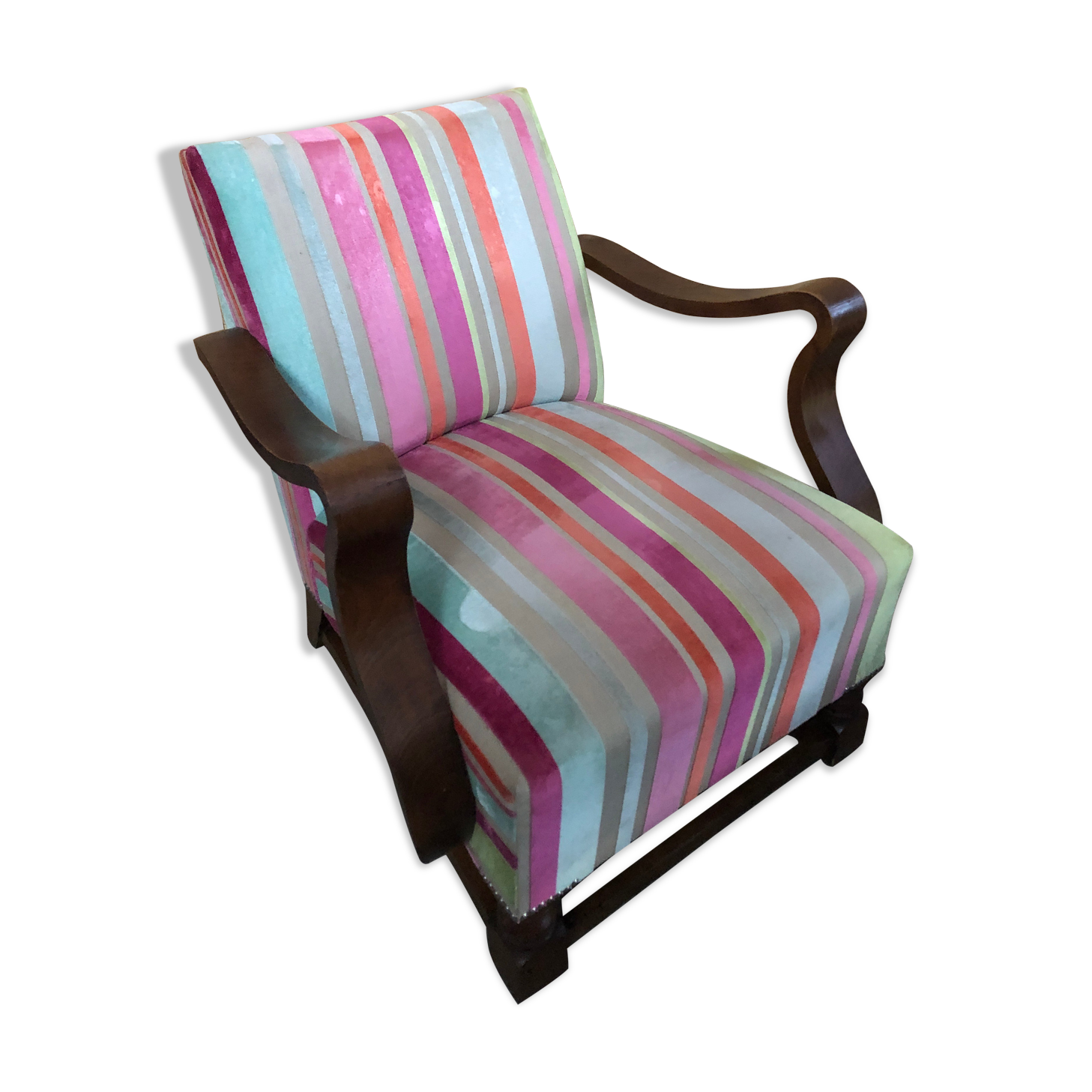 Old wooden armchair with curved armrests