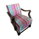 Old wooden armchair with curved armrests