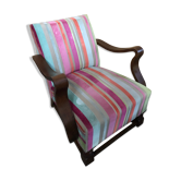 Old wooden armchair with curved armrests