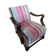 Old wooden armchair with curved armrests
