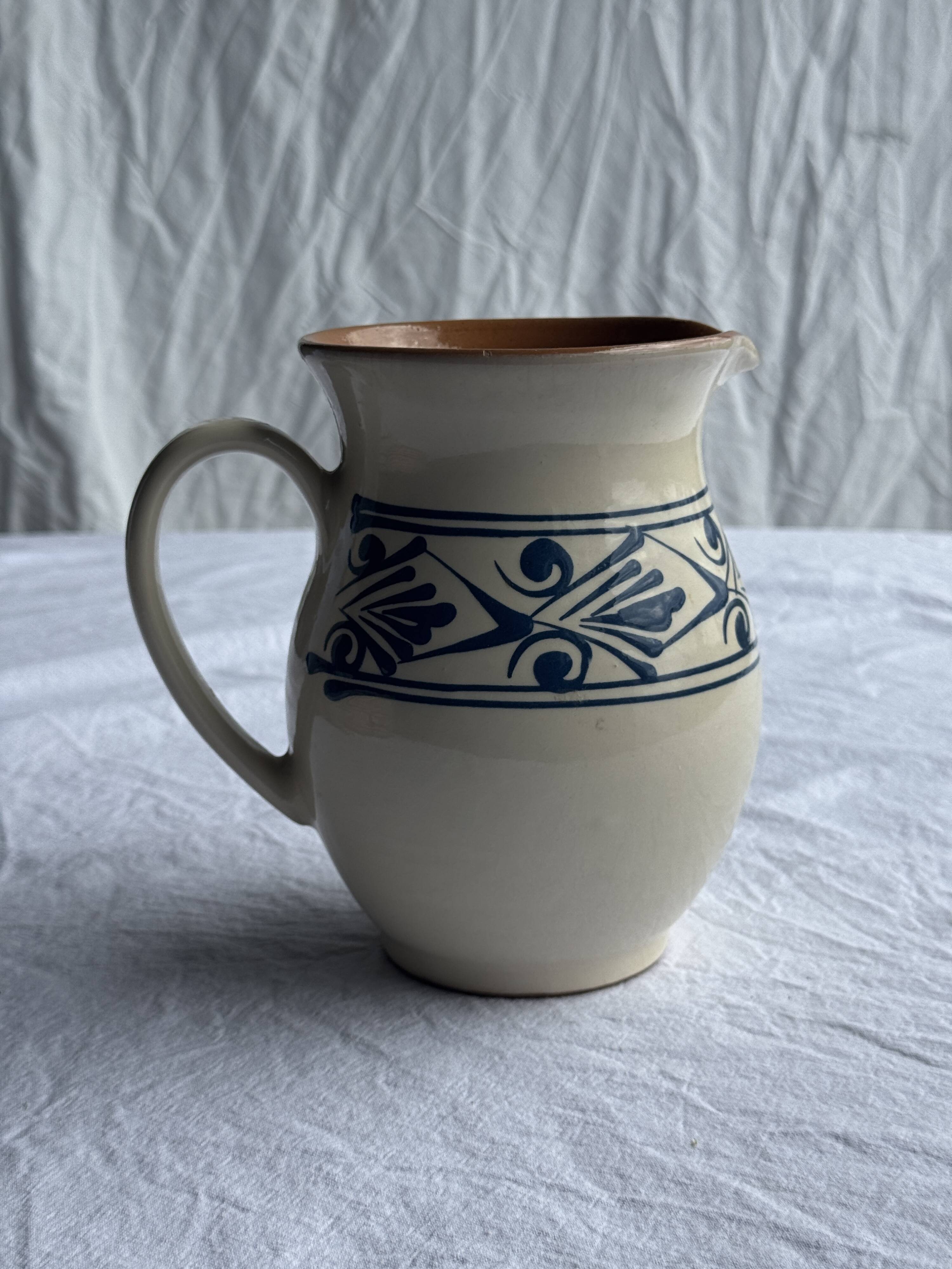 Vintage white pitcher with stylized blue plant frieze H17.5