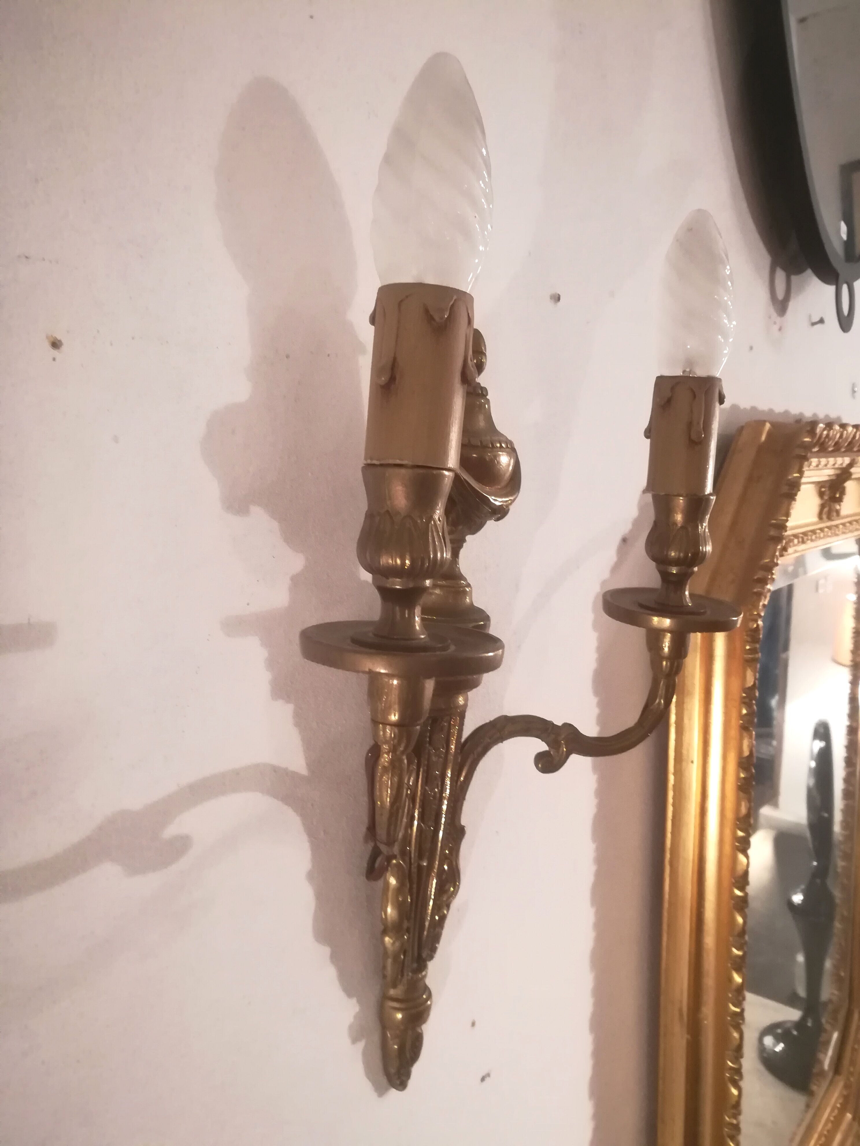 Pair of Louis XVI style sconces in gilded bronze