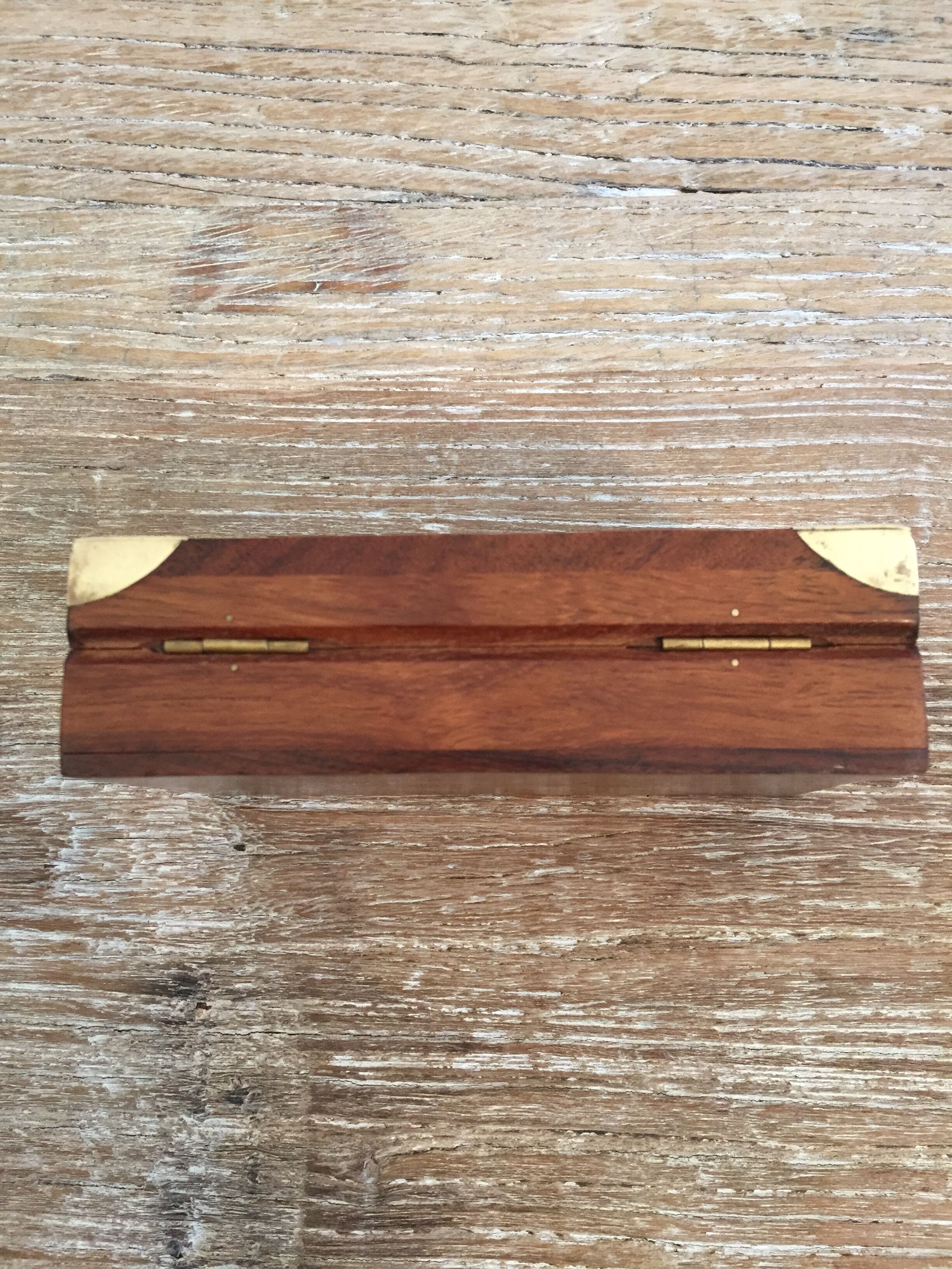 Small cabinet in walnut and brass
