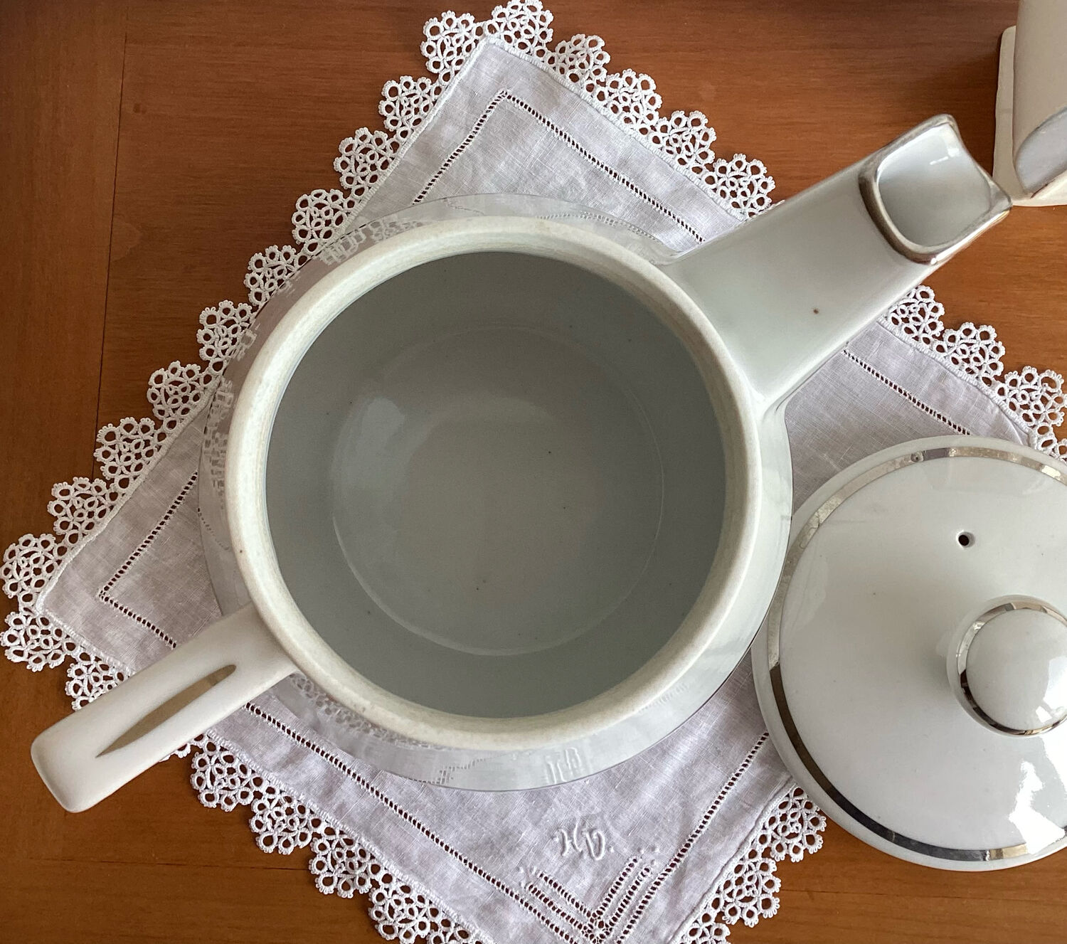 Antique porcelain coffee pot with stamped fire