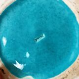 Ceramic trivet and bottle coaster from the 1950s.