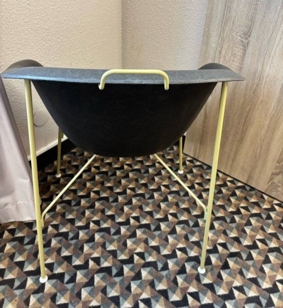 Designer armchair with a black shell – metal frame