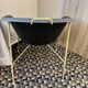 Designer armchair with a black shell – metal frame
