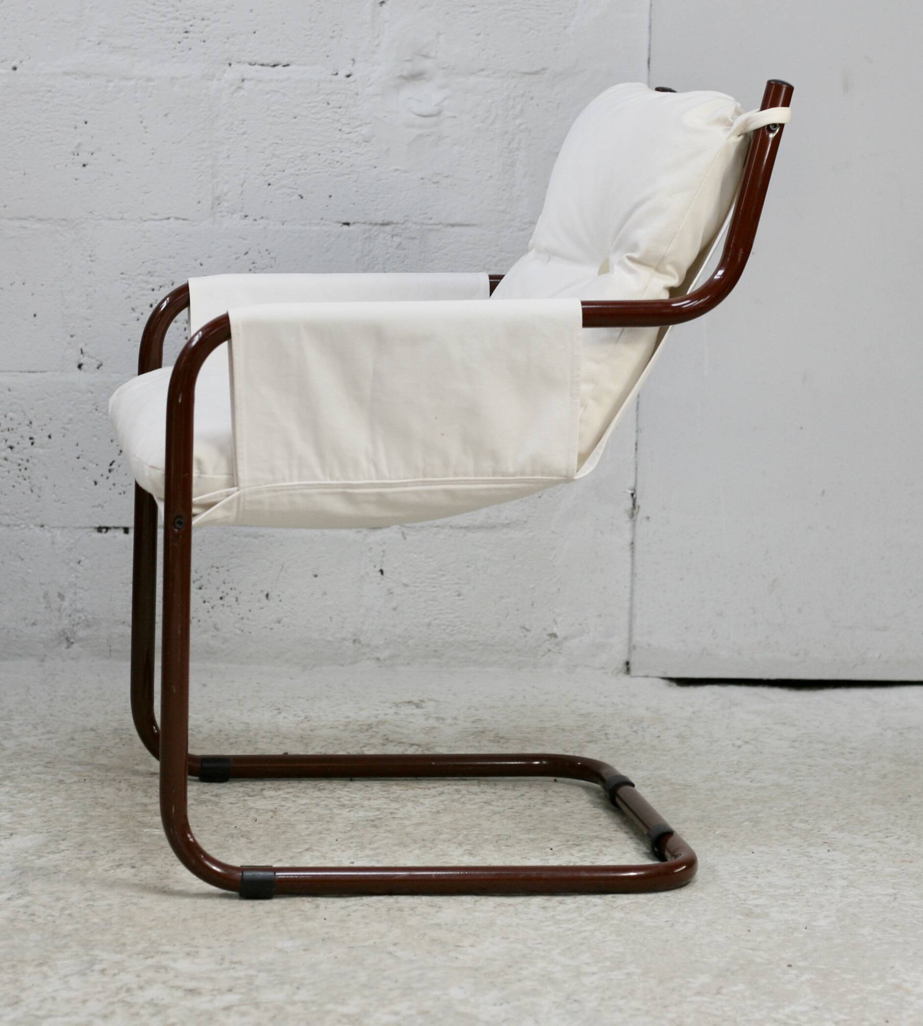 Tubular armchair, fabric suspended seat. Circa 1970