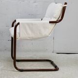 Tubular armchair, fabric suspended seat. Circa 1970