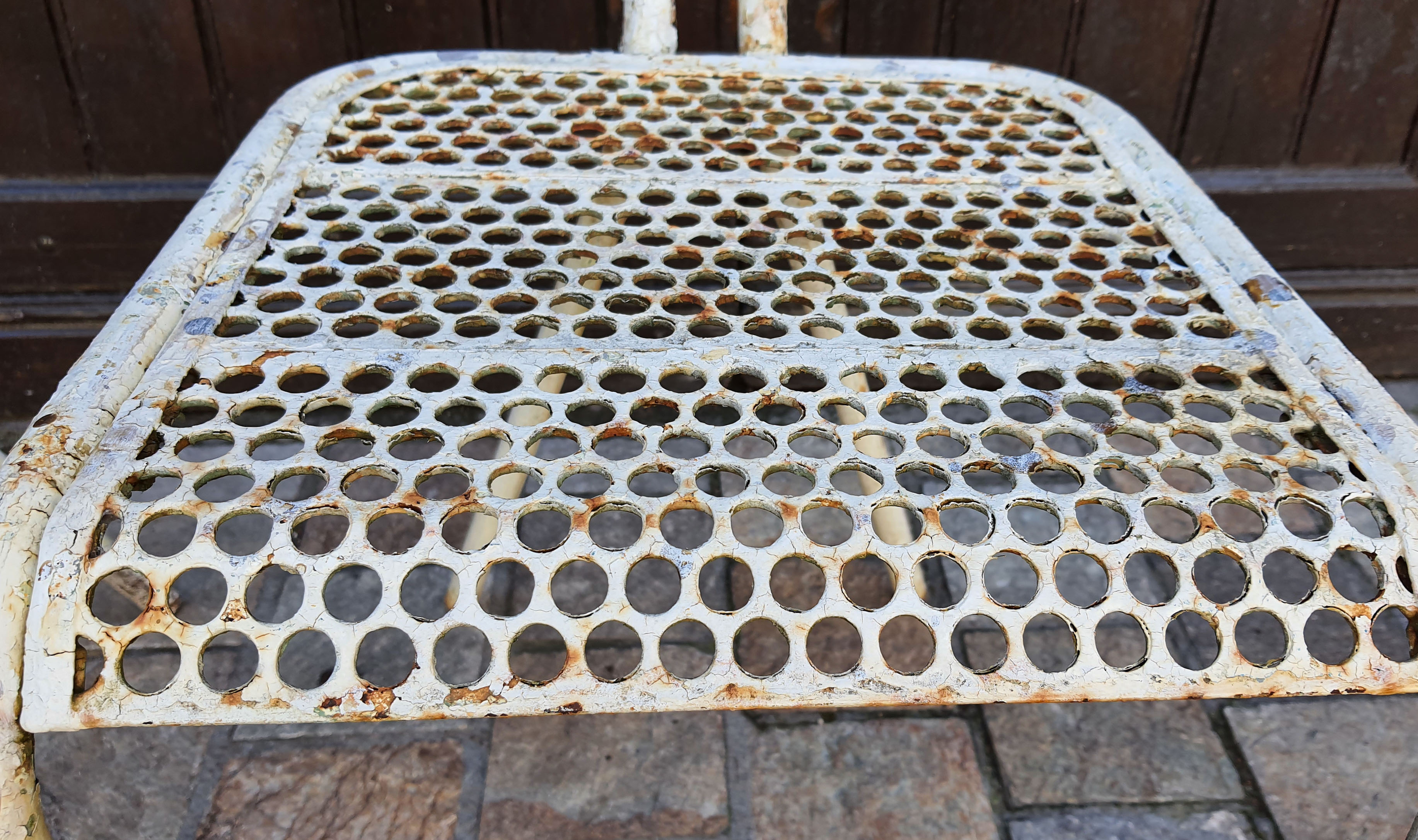 Perforated metal chairs René Malaval 1950