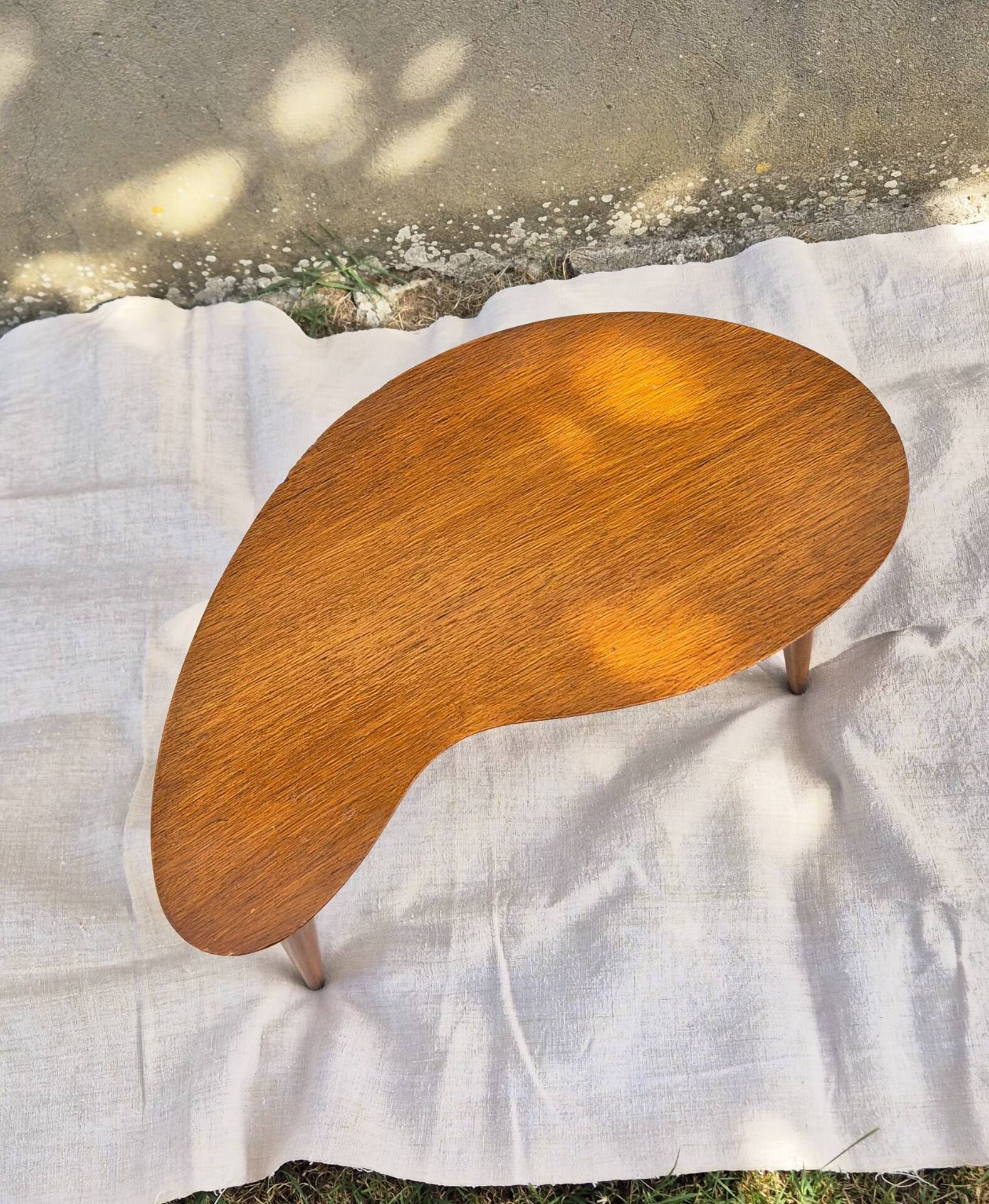 Vintage Scandinavian bean side table with wooden tapered legs.
