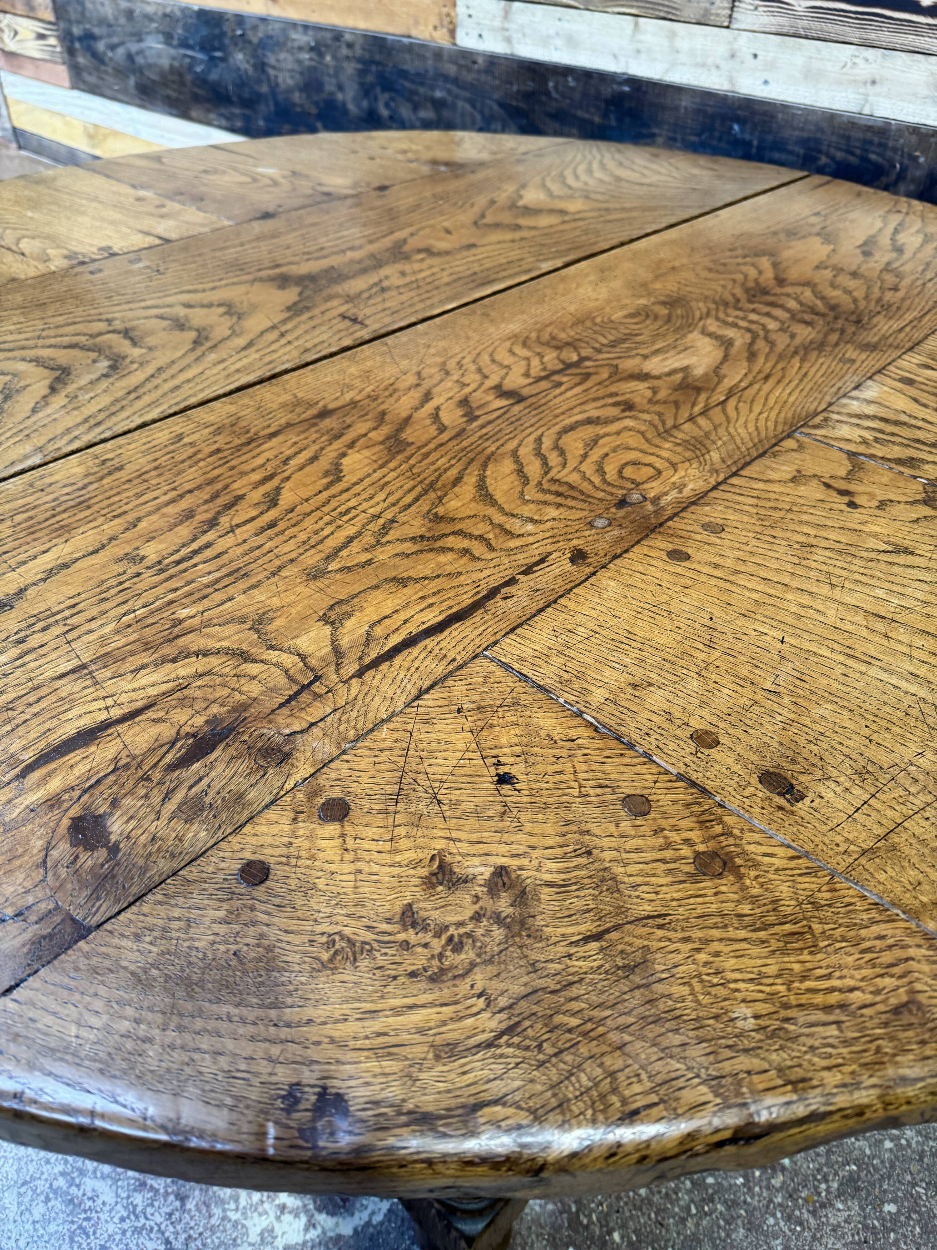 Antique oak round table with extensions, beautifully made from the years.