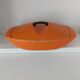 Double casserole in orange cast iron Le Creuset design Raymond Loewy