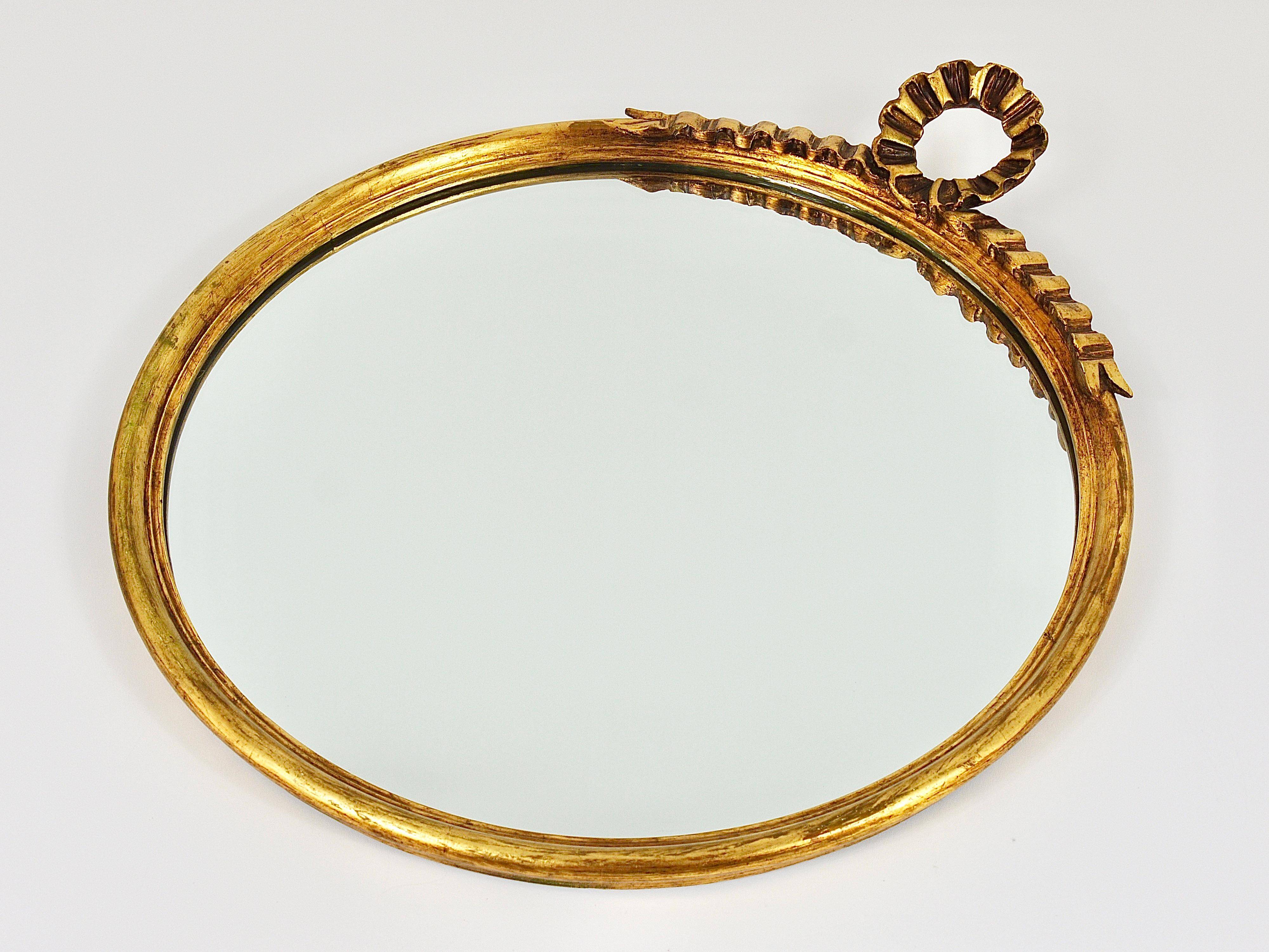 Round wall mirror in gilded wood, mid-century, C. Allodi & G. Subelli, Italy, 1950s.