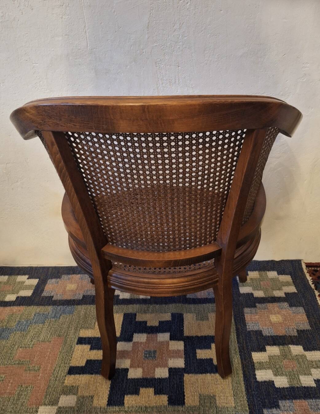 Half-moon rattan and hardwood armchair, early 20th century
