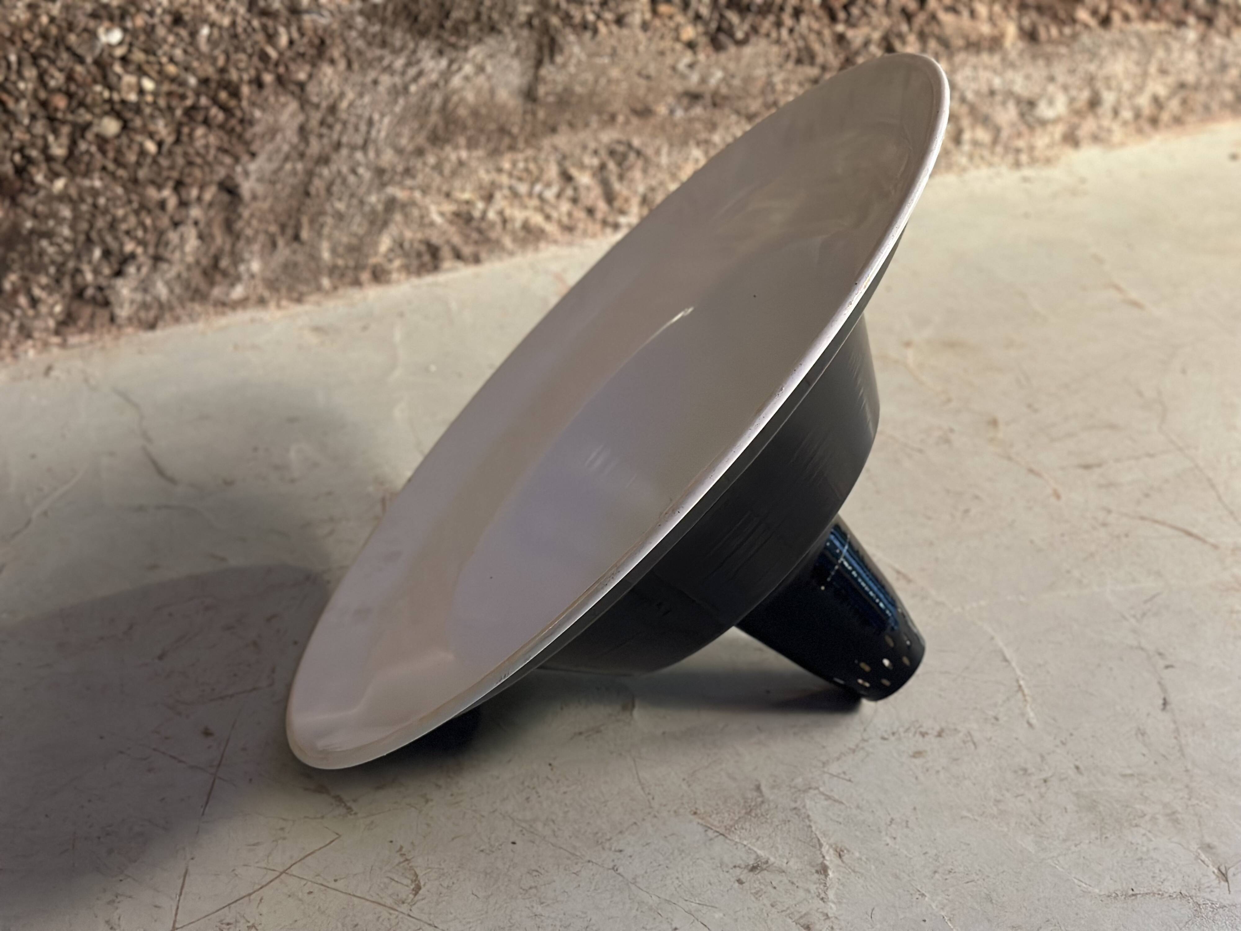 Large industrial pendant lampshade in black enamelled sheet metal.