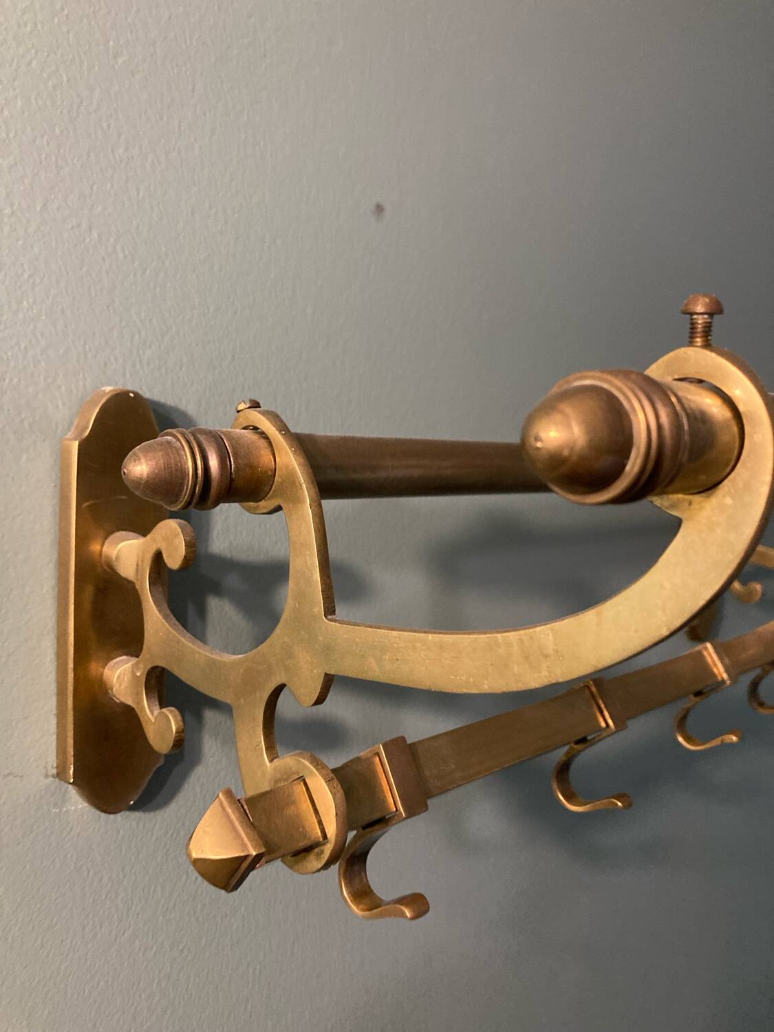 Antique brass coat rack and wall-mounted hat holder