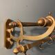 Antique brass coat rack and wall-mounted hat holder