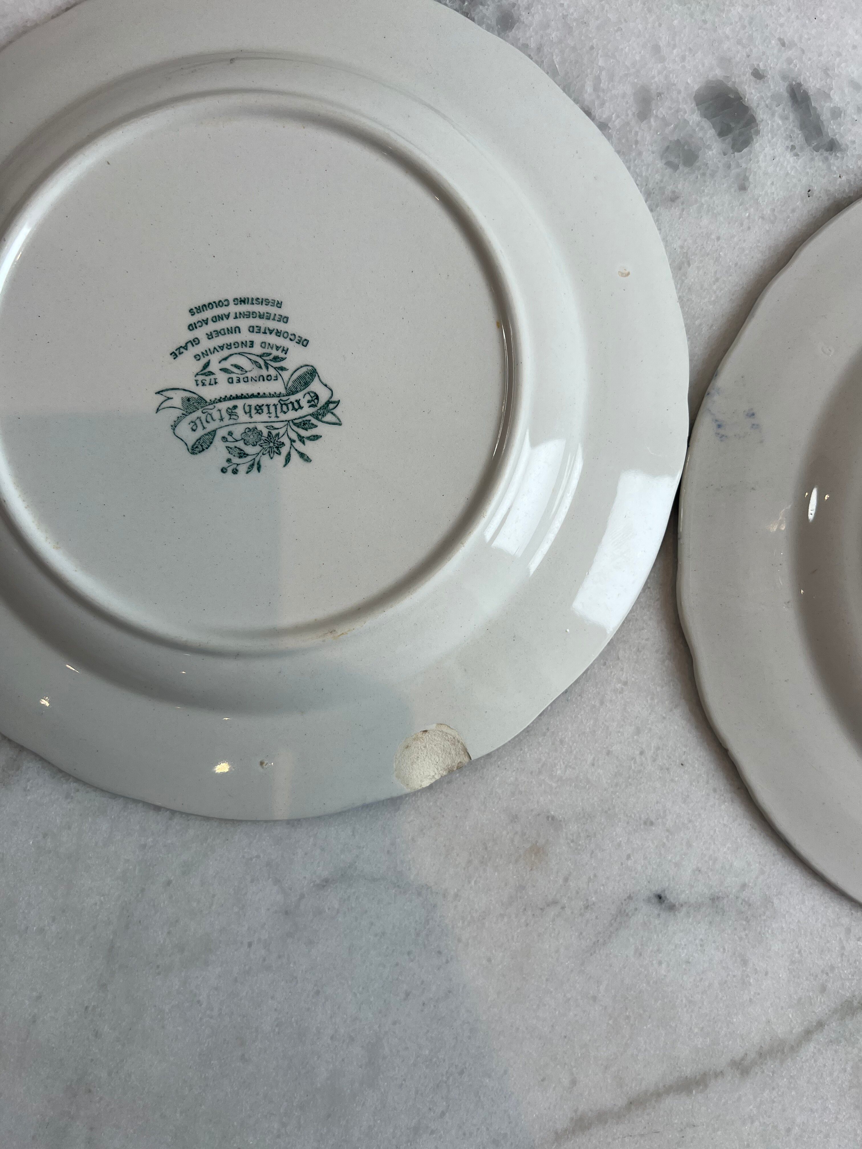 Set of four flat plates from English earthenware.