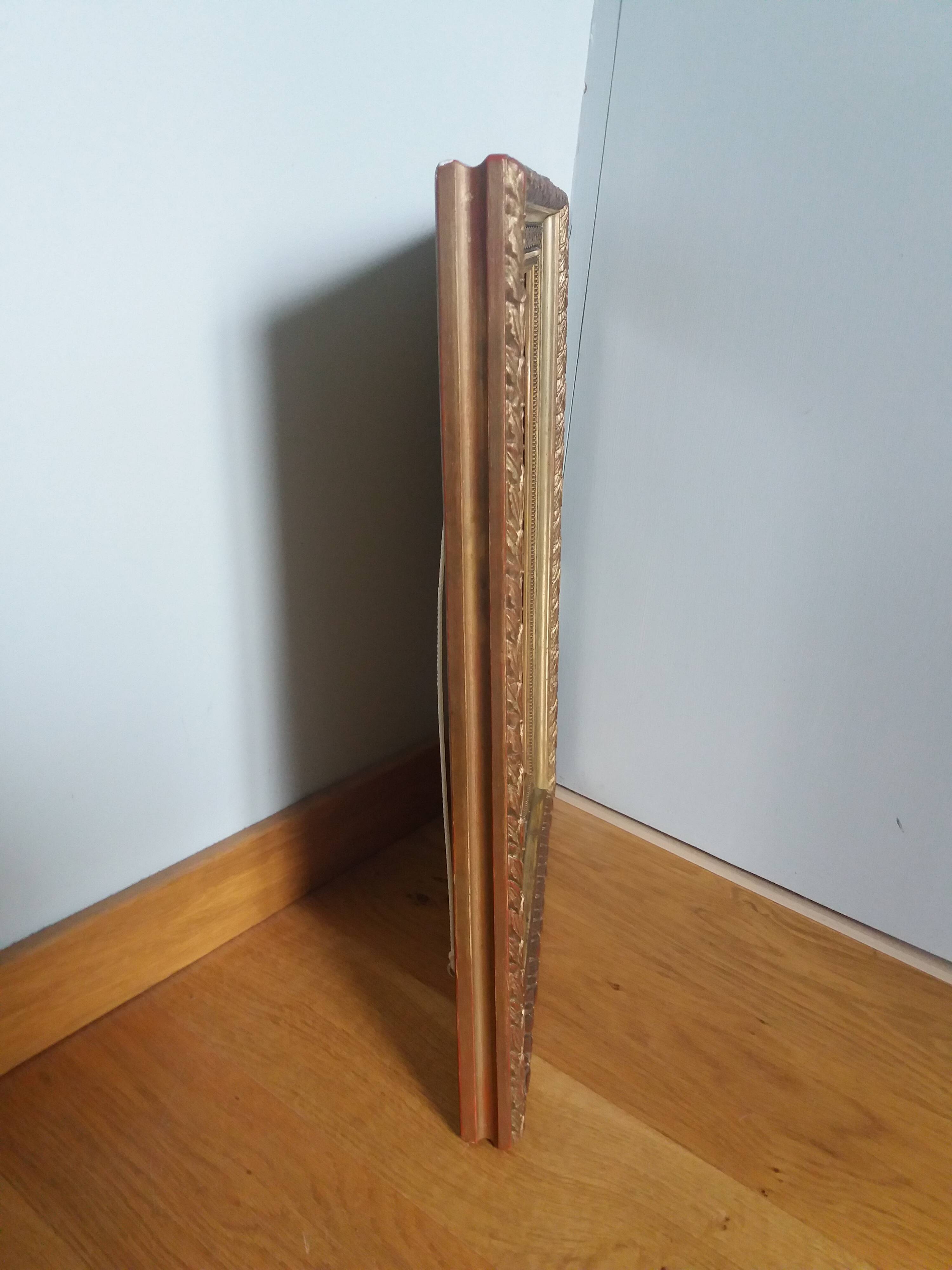 Old photo portrait framed in wood and stucco